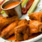 Hot wings hot deals celebrate national chicken wing day with a saucy kick feature.jpg