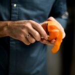 Man peeling an orange.jpg