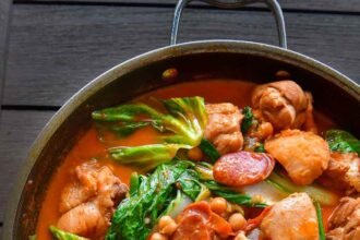 Pocherong manok in a wok.jpg