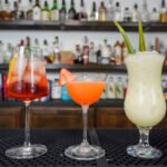 3 virgin drinks on a bar non alcoholic versions of classic drinks.jpg