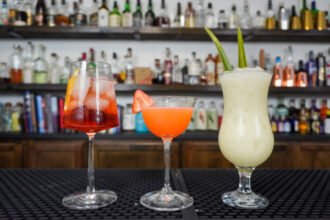 3 virgin drinks on a bar non alcoholic versions of classic drinks.jpg