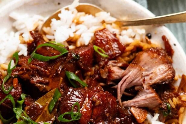 Pork adobo served with rice.jpg