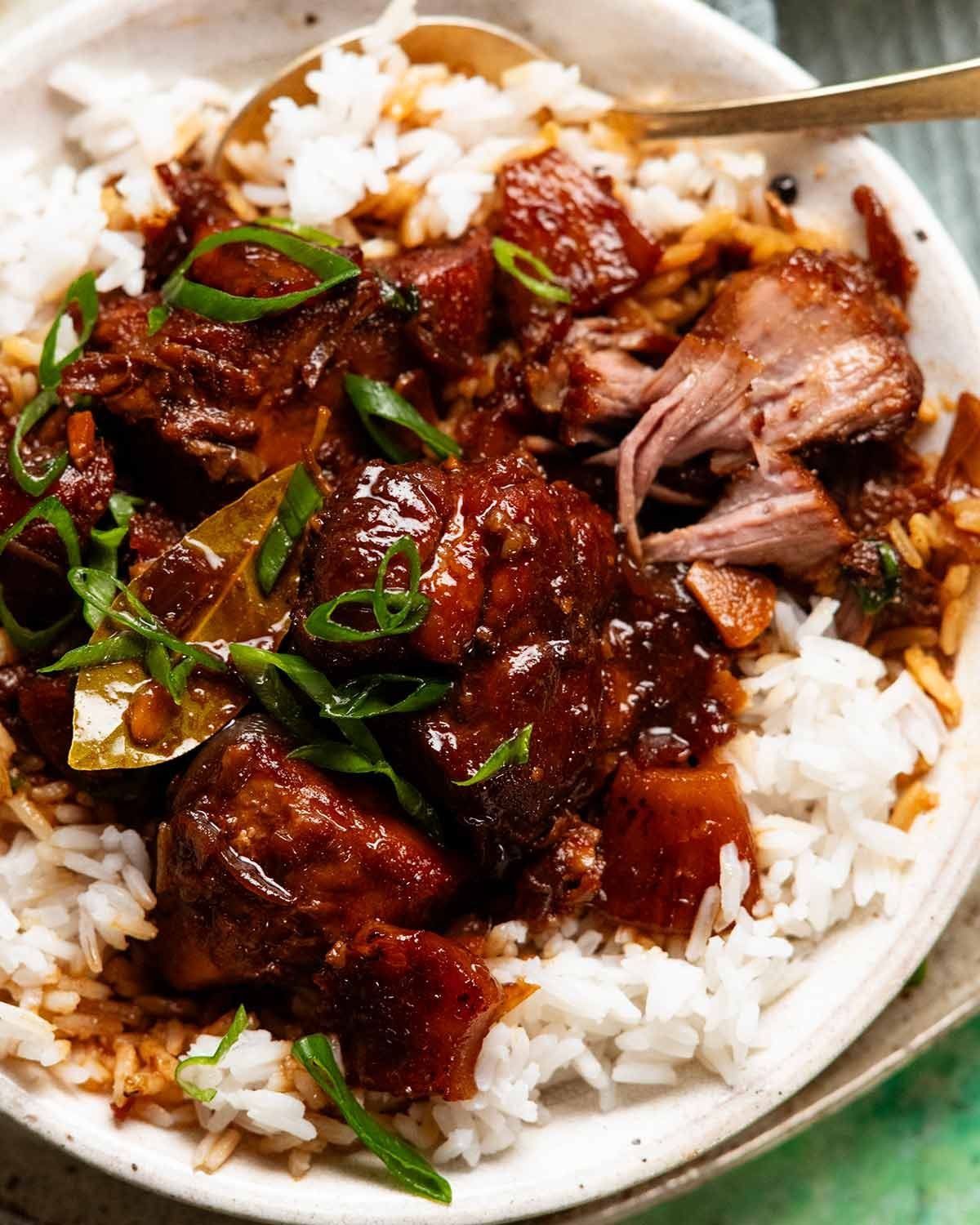 Pork adobo served with rice.jpg