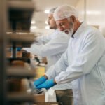 Bigstock workers packing cookies in box 468603197.jpg